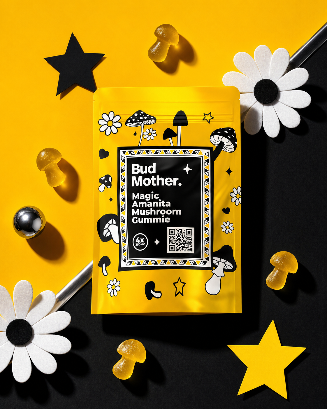 Overhead BUD MOTHER mushroom gummy packaging flat lay with amber mushroom-shaped gummies, daisies, stars and chrome details