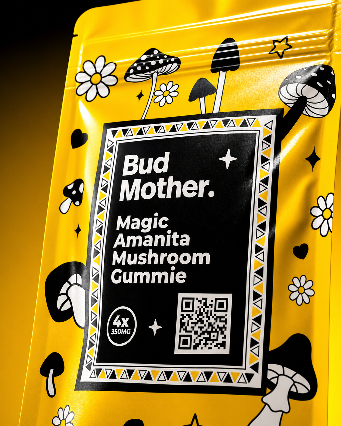 Close-up of BUD MOTHER mushroom gummy pouch showing the wordmark, black label, triangular border, illustrated mushrooms and yellow film texture