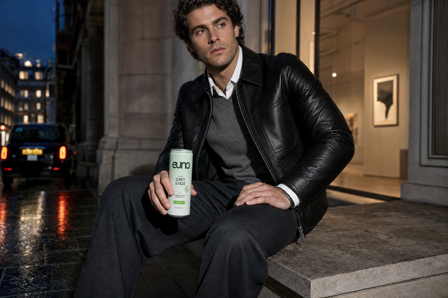 Fashion editorial portrait of a professional man holding an Euno functional drink during an evening in Central London