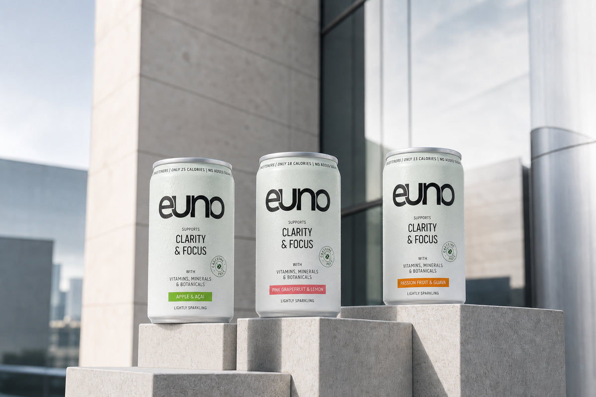Euno Apple and Acai, Pink Grapefruit and Lemon, and Passion Fruit and Guava functional drink cans in a premium Central London campaign setting