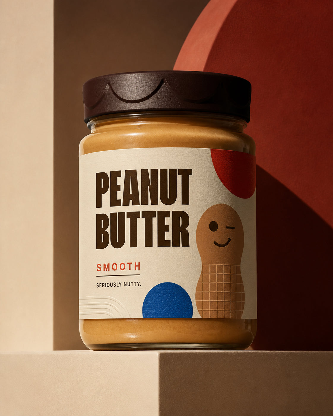 Seriously Nutty Smooth peanut butter glass jar hero shot with cream label, winking peanut character and dark sculpted lid.