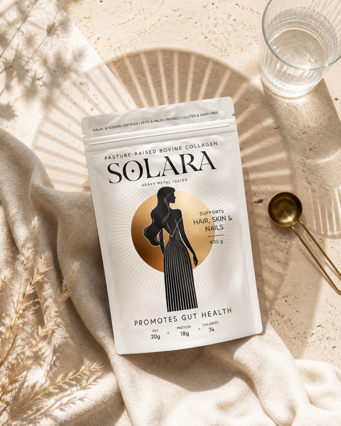Overhead SOLARA bovine collagen pouch flat lay with linen, water, brass spoon and architectural sun shadows